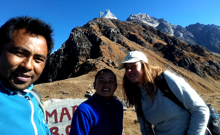 guide minar and customer at Mardi Himal Base Camp, fishtail view